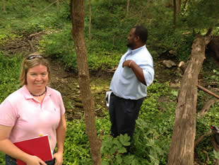 Parks Department personnel inspect the spring area in 2012.